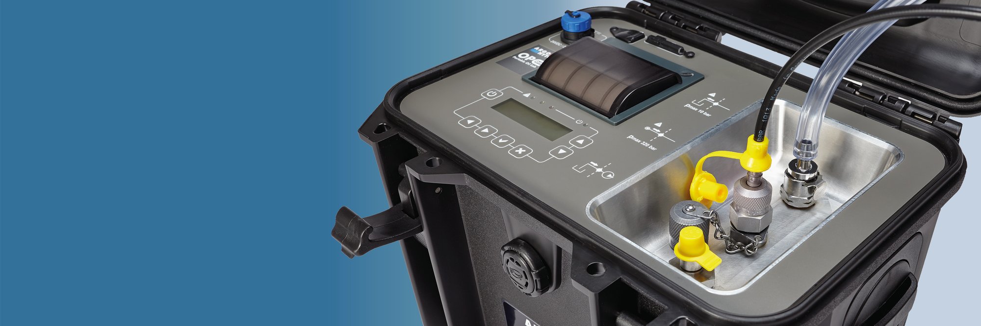 Portable oil condition monitoring unit with integrated display, control panel and fluid connections in a rugged carrying case.