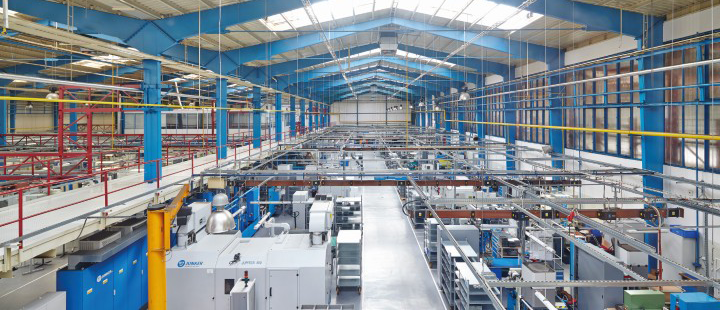 Industrial production facility with automated manufacturing equipment and interconnected production lines Industrial production facility with automated manufacturing equipment and interconnected production lines