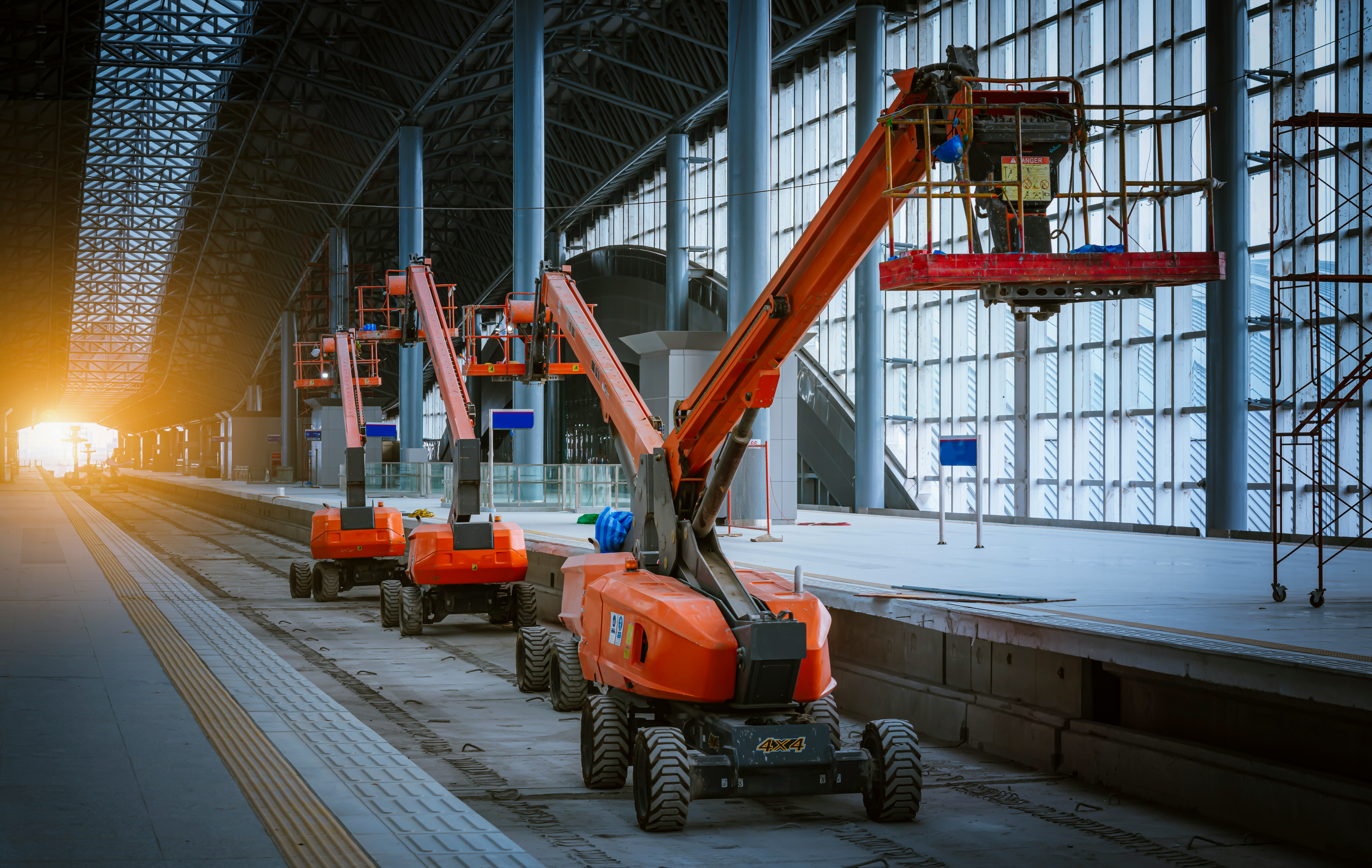 Mobile elevating work platforms operating inside a large industrial construction and maintenance facility